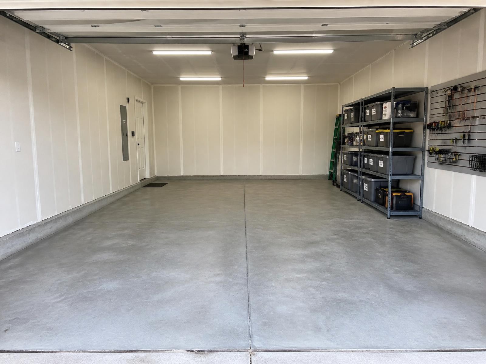 Refresh Package before and after: cluttered garage transformed into a clean, organized space with shelving, slat wall storage, and LED lighting — after